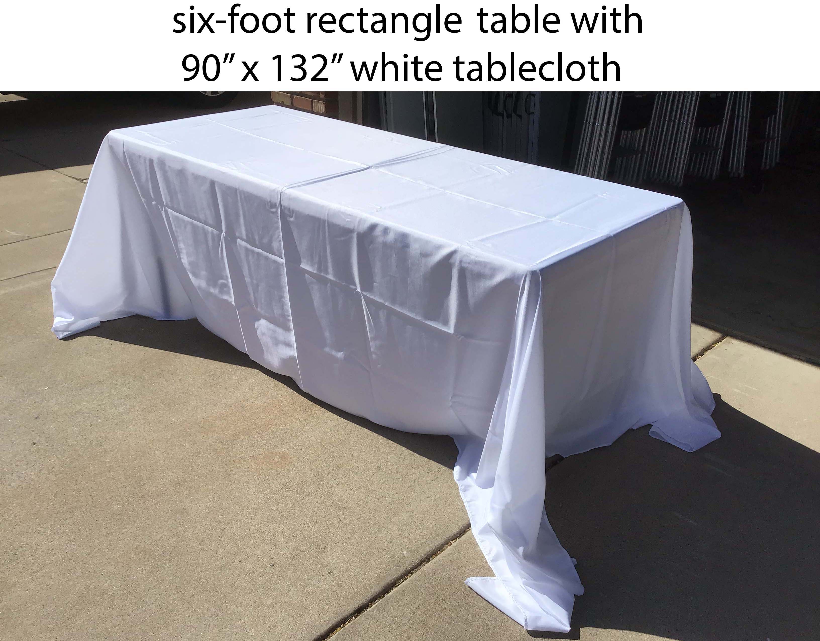 90 inch x 132 inch rectangle white tablecloth on a six-foot rectangle table