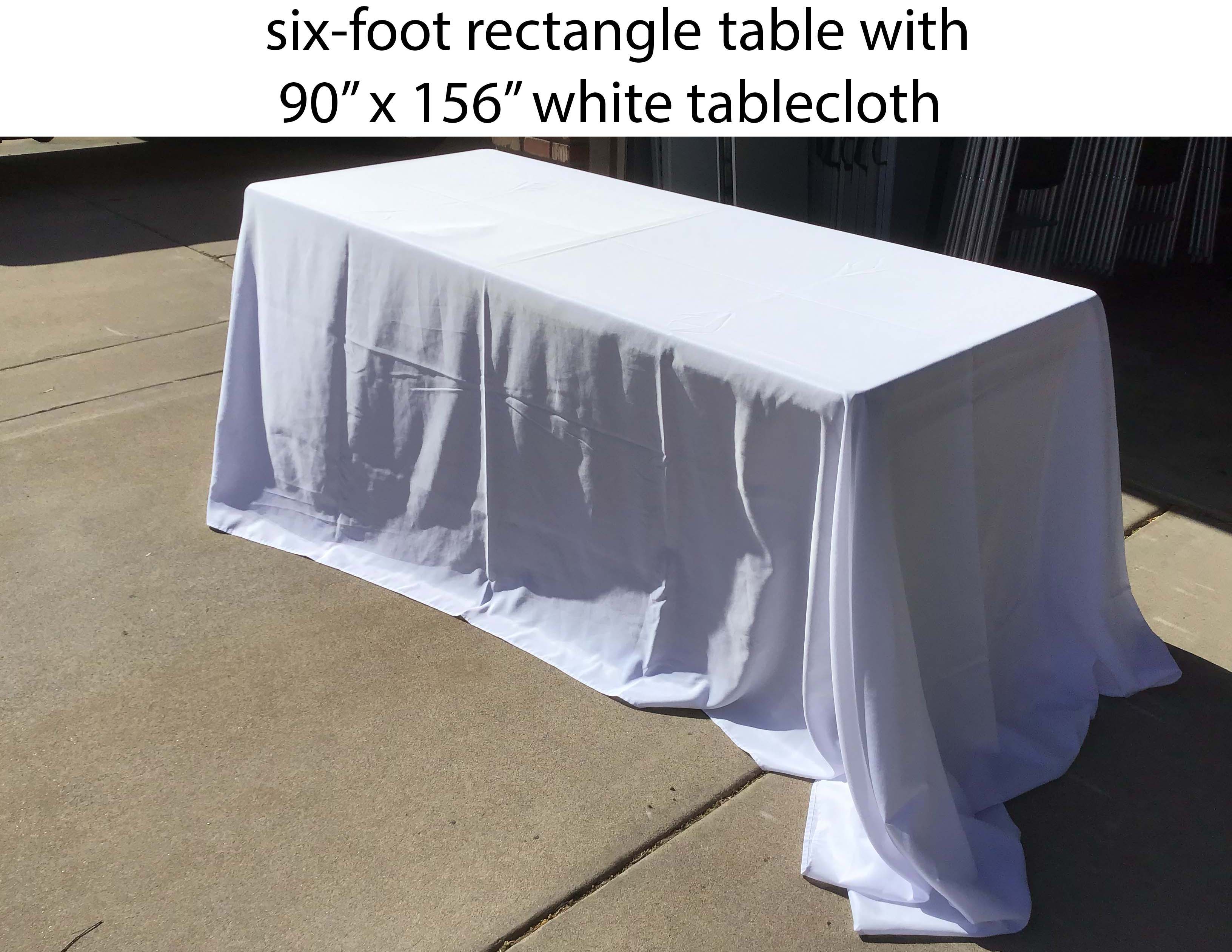 90 inch x 156 inch rectangle white tablecloth on a six-foot rectangle table