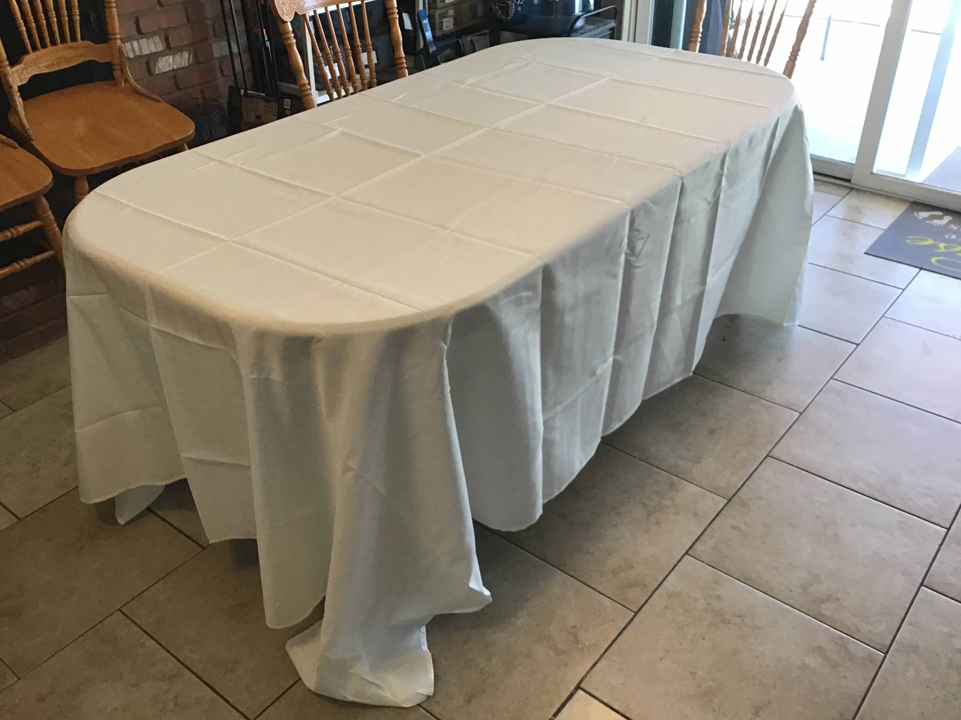 wrinkled tablecloth, fresh out of its original packaging on a table