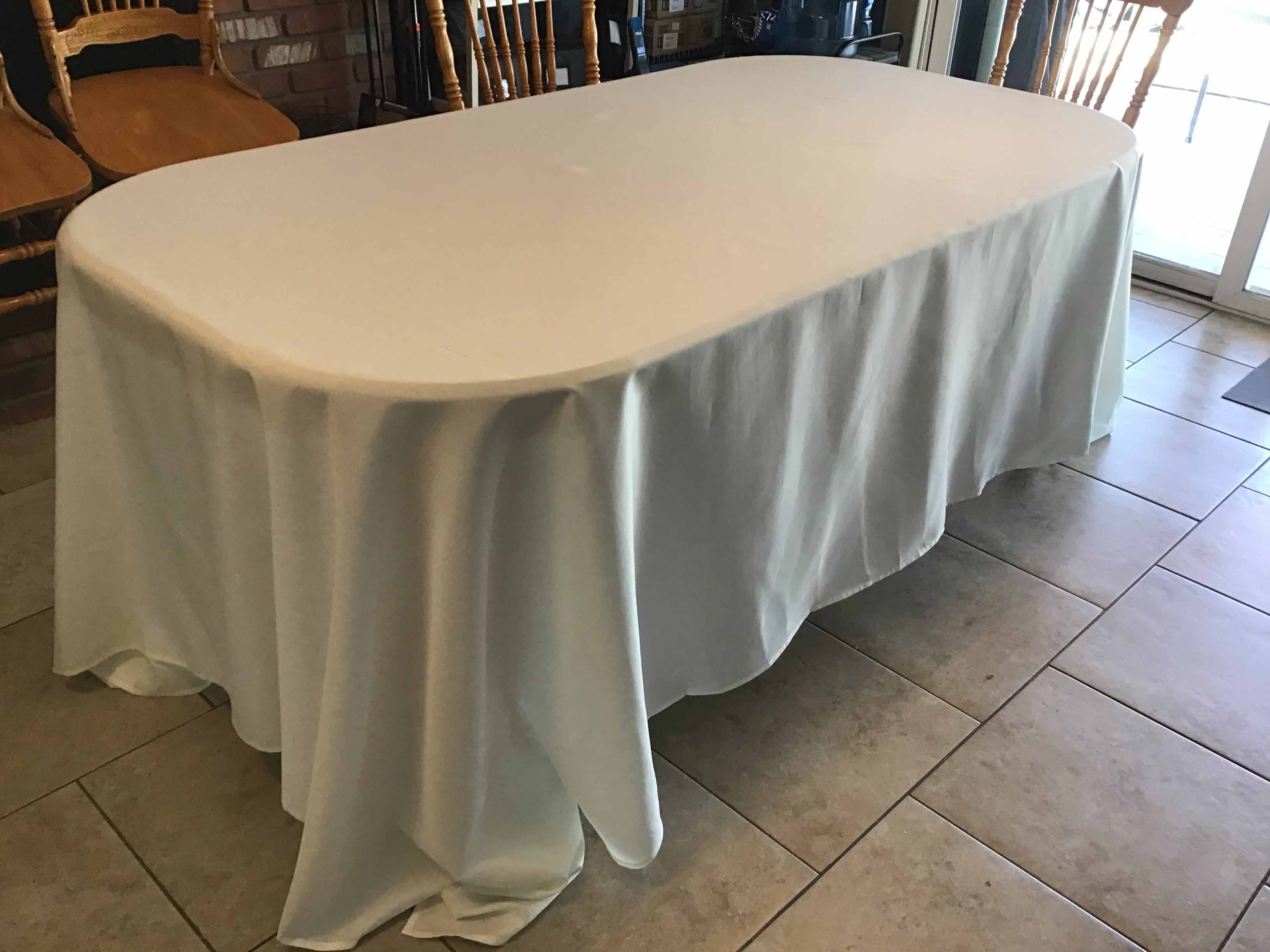 a tablecloth, after having been ironed, on a table, no longer wrinkled