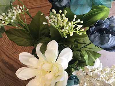 box of plastic/silk flowers