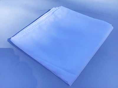 60 inch x 126 inch white rectangle tablecloths pulled directly from storage tote and put onto eight-foot rectangle tables